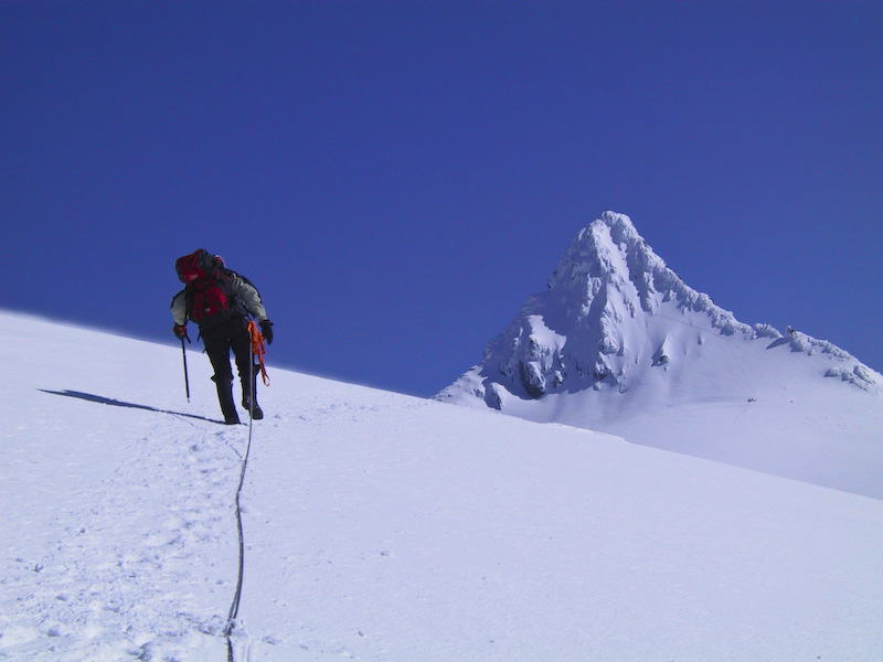 Climber Ascending Sulphide Glacier Toward Summit Pyramid Of Mount Shuksan